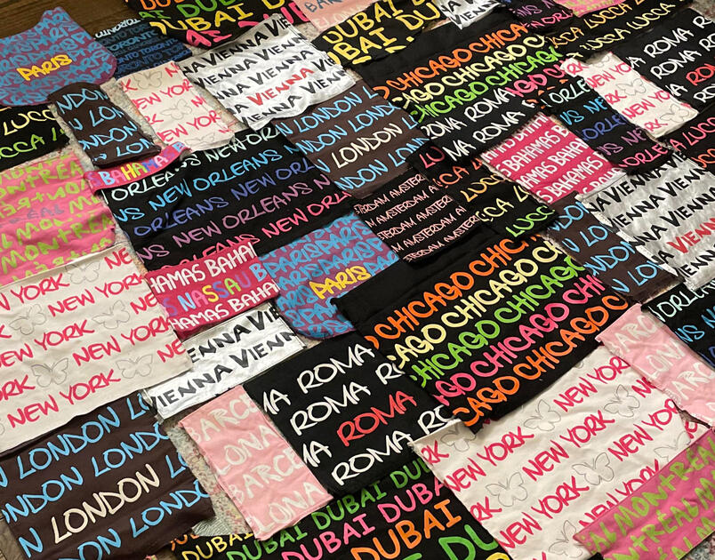 Upcycled dress made from 20+ souvenir bags purchased internationally